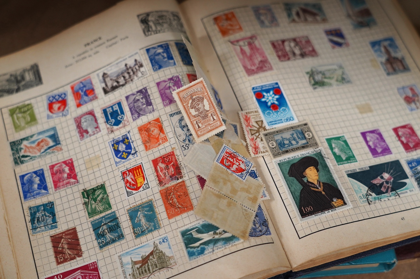 Stock books and albums of stamps, including various Victorian stamps, early 20th century stamps, a framed envelope with a perforated penny red, the Roland Hill stamp album, etc. Condition - poor to fair